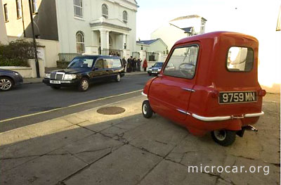 peelp50_funeral One of the few remaining Peel P50 microcars is passed by the coffin of its inventor and Peel Engineering Company founder Cyril Cannell